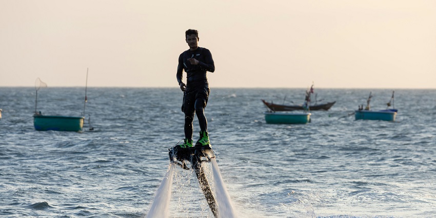 Enjoy flyboarding as part of one of the best Mandwa Beach water sports.