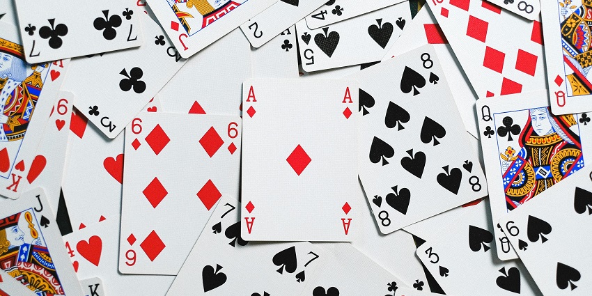 Playing cards displayed over a table at a casino.