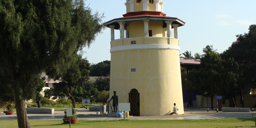 A view of open lawns and pathways at Freedom Park, Bengaluru, with historic jail remnants.