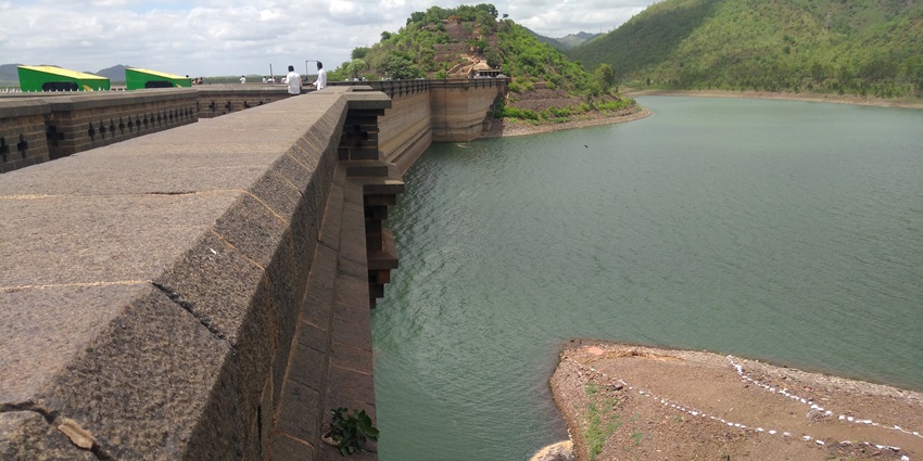 The Gajanur Dam is an expansive water reservoir with scenic views surrounding it.