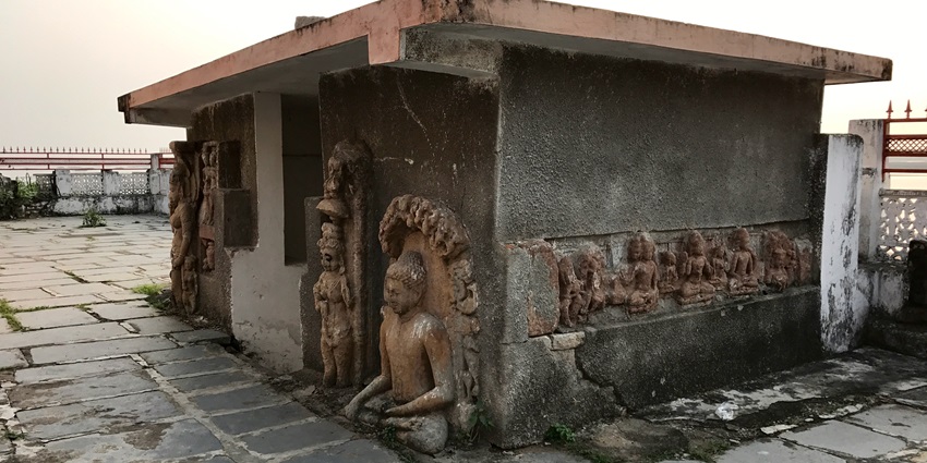 The Gandheshwar temple showcasing idols of Hindu and Buddhist deities during the day.
