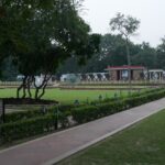 Gandhi Museum National Park with walking paths surrounded by greenery and sculptures