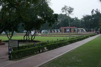 Gandhi Museum National Park with walking paths surrounded by greenery and sculptures