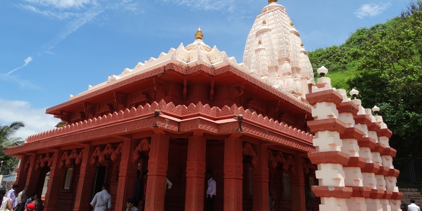 A picture of a worship house with intricate carvings and traditional architecture