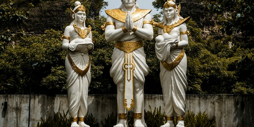 An image of the massive Garuda Wisnu Kencana (GWK) statue under a clear blue sky.