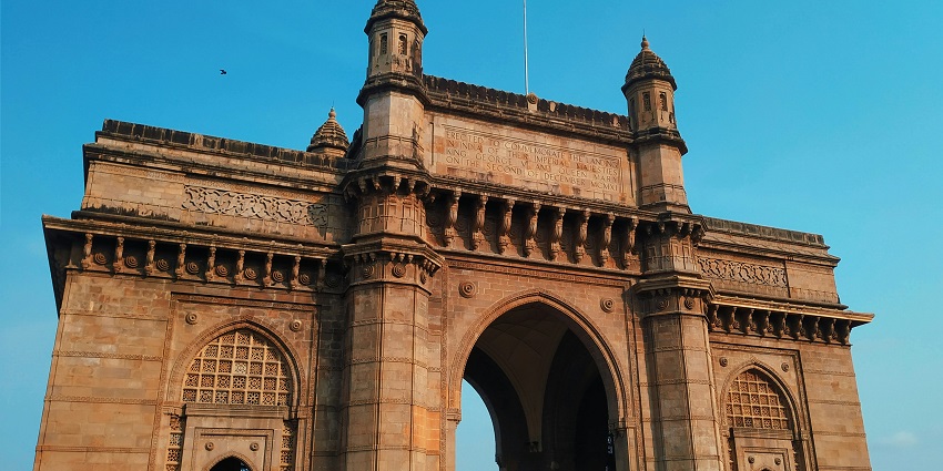 The Gateway of India, built in 1924, is an iconic Mumbai arch overlooking the sea.