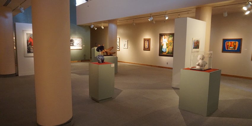 An inside view of the Genesis Art Gallery displaying iconic paintings and sculptures.