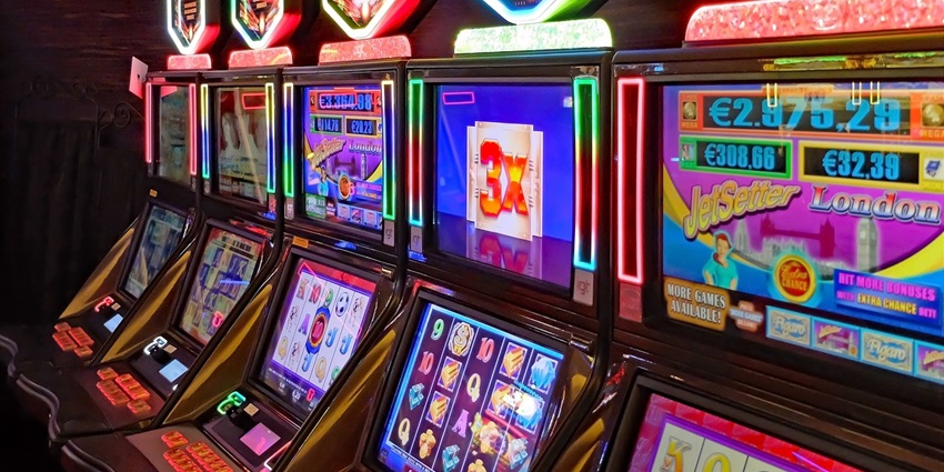 A picture of slot machines at a casino in Bristol UK with colourful lights.