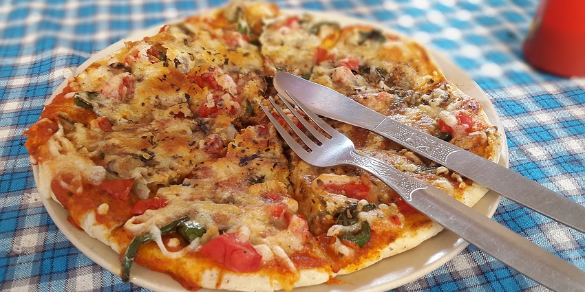 An image of a Pizza which is the best food in Pune, Maharashtra among the food lovers.