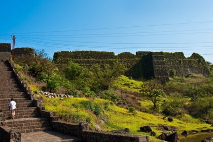 Stunning view of the Gharapuri fort, surrounded by vibrant yellow forts