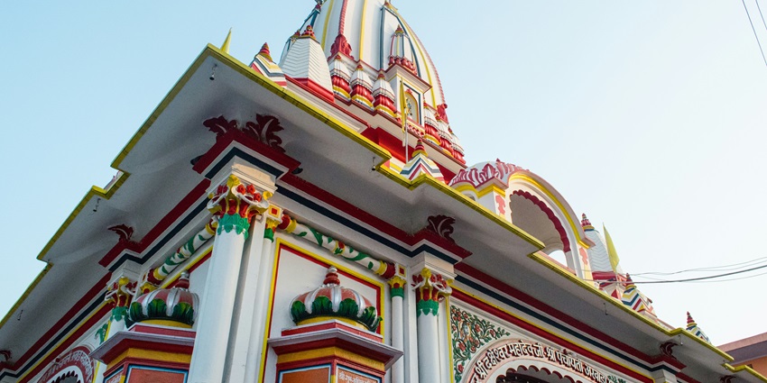 A low-angle view of the iconic Ghatandevi Temple, a spiritual attraction in Maharashtra.