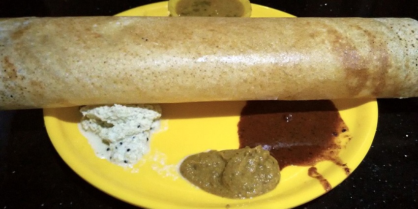 The best food in Coimbatore is the crispy dosa cooked with ghee and served with chutney.