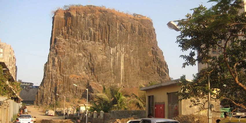 Gilbert Hill is a 200-million-year-old monolithic basalt rock offering panoramic views of Mumbai.