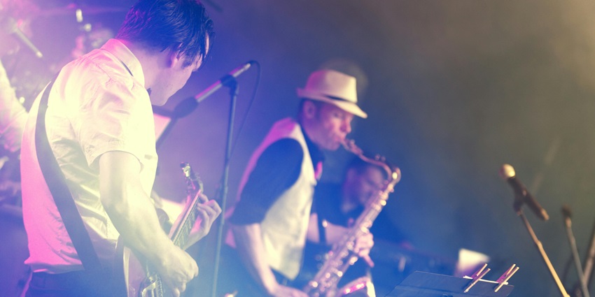 An image of diverse artists performing at the Global Music Festival Chandigarh, showcasing various musical genres and cultural engagement.