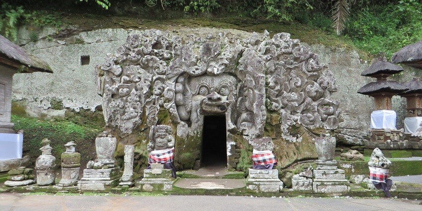 Stone statues are kept at the entrance of Goa Gajah or Elephant Cave, one of the best places to visit in Ubud.