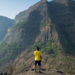 An image showing a majestic trekking hills under a clear blue sky - Gorakhgad Fort