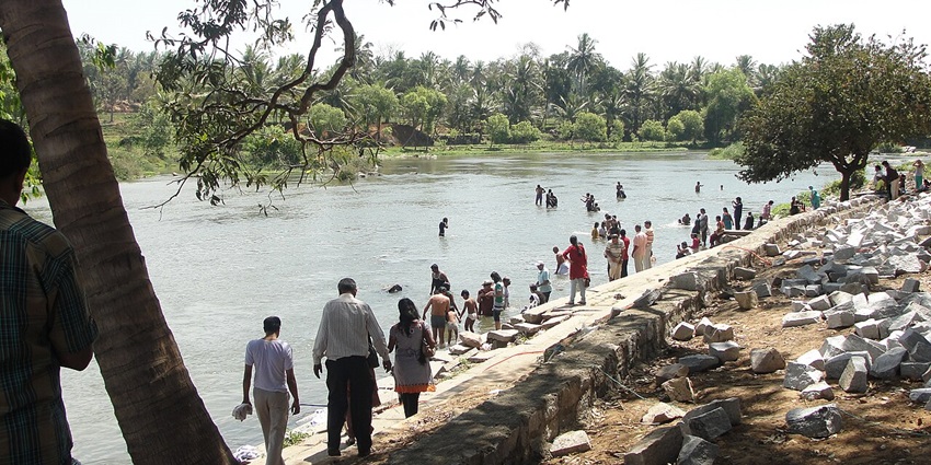 A serene riverside ghat on the banks of the Kaveri, ideal for meditation and rituals.