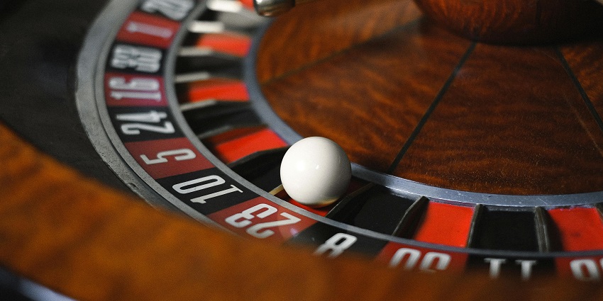 Image Of the rolling ball on the table in the casino where betting is going on.