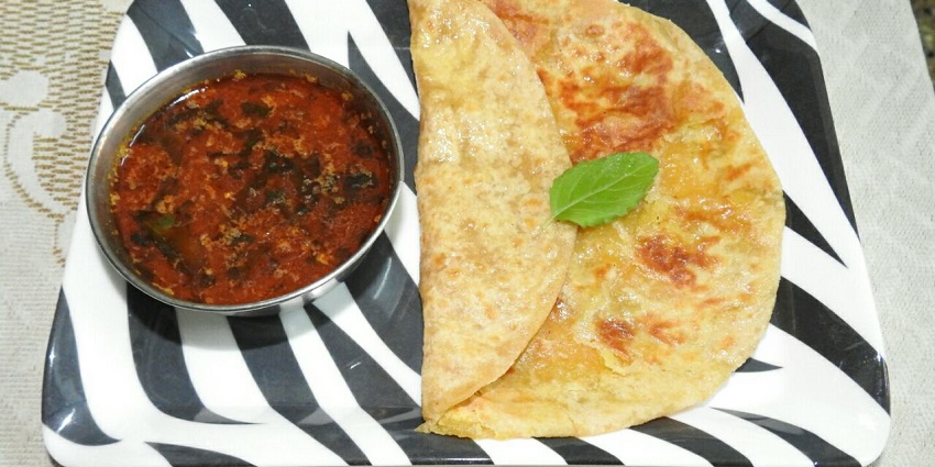 A Maharashtrian dish is placed in a zebra print rectangular plate alongside Katachi Amti