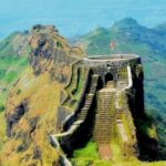 Majestic view of Gumtara Fort perched on a hill and surrounded by lush greenery.