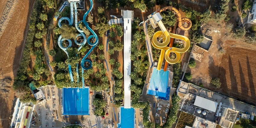 An aerial picture of a water park in Vijayawada with numerous slides and a swimming pool visible