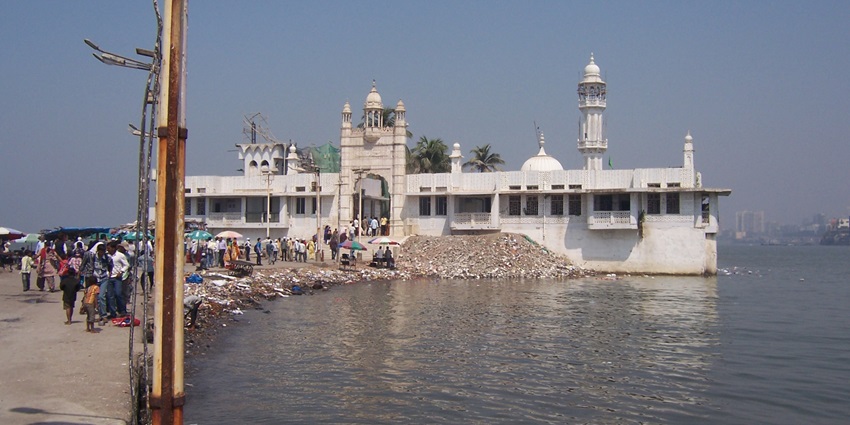 Haji Ali Dargah, a stunning mosque surrounded by water, showcasing intricate architecture