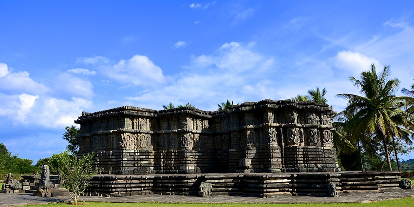A picture of a historical monument in Karnataka with stunning views in the background
