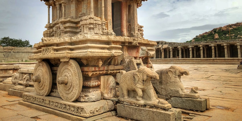 Hampi, the romantic ancient ruins, stunning sunsets, and serene river rides.