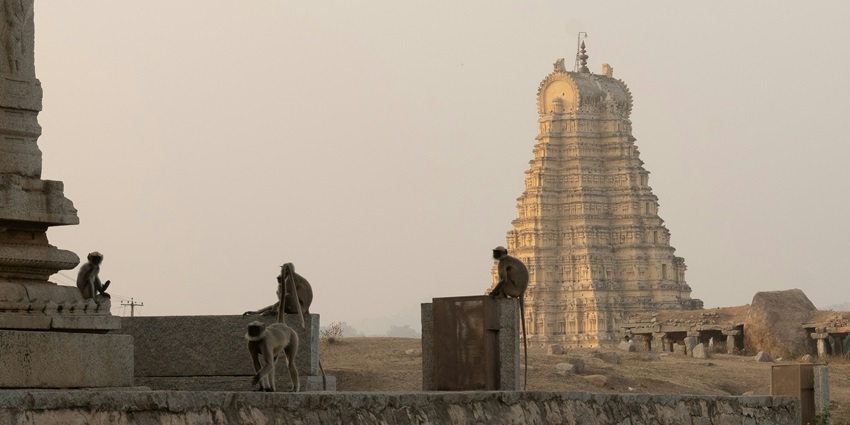 Hampi features ancient ruins and lush landscapes, perfect for exploration for travellers.