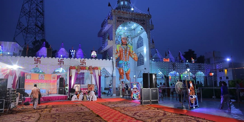 A huge idol of the god Hanuman is situated in the temple around which devotees are present