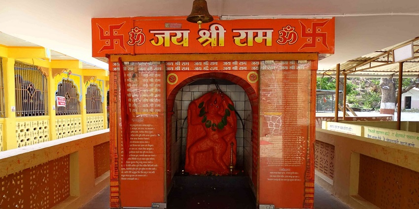Exterior view of the Hanuman Temple at Tungareshwar, featuring ornate architecture and vibrant colours