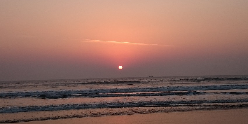 Coastal town features serene beaches, ancient temples, relaxation, and spirituality.