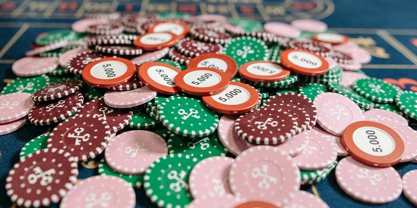 A glimpse of colourful studs being displayed on the table for a quick game of poker.