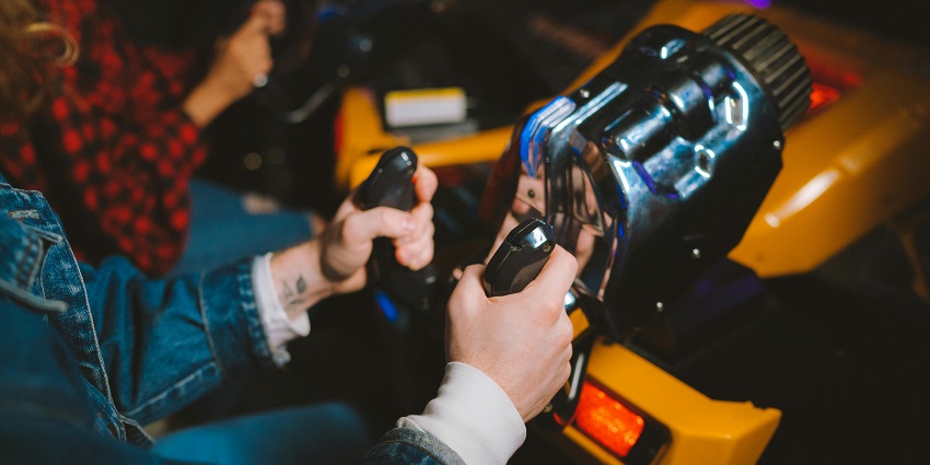 Joyful couple enjoying fun arcade games together, creating cherished memories!