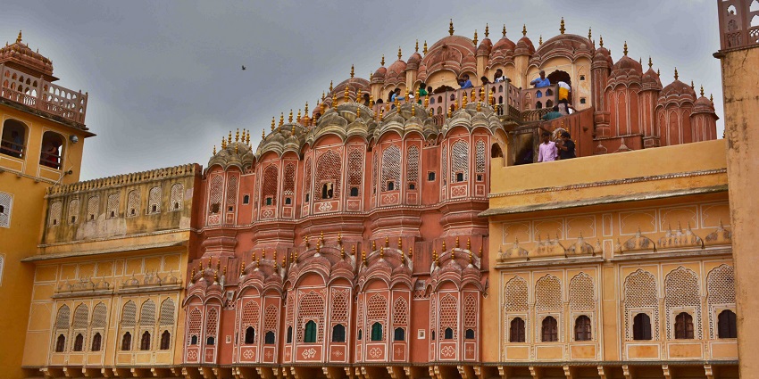 Hawa Mahal in Jaipur displays its red and pink sandstone with latticework windows.