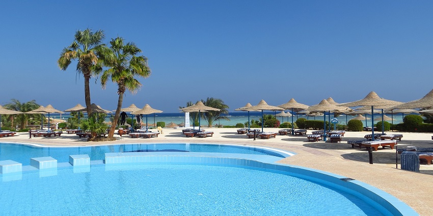 A serene poolside with clear water, one of the best resorts near Koyna Wildlife Sanctuary.