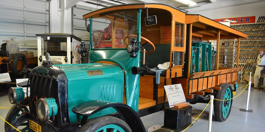 View of a truck inside the transport museum, reflecting onto the evolution of vehicles