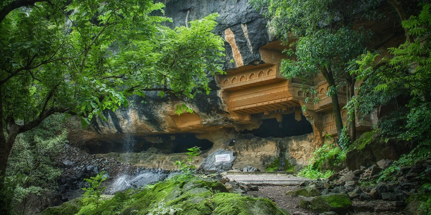 Kune Waterfalls cascading amidst green hills, a breathtaking sight, especially during the monsoon season.