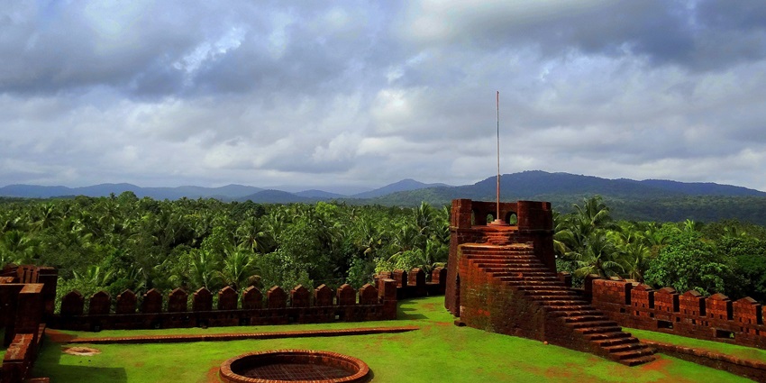 A picture of the famous Mirjan Fort with lush plantations visible all around