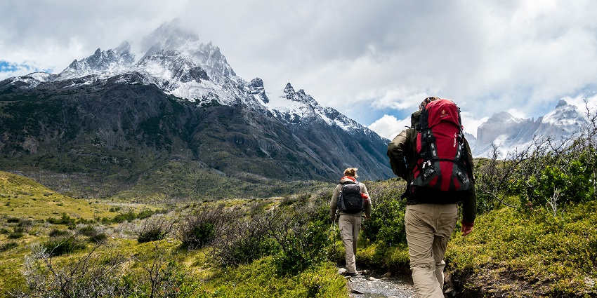 View of two travellers trekking upon the Horagina Betta, an ideal activity for adventure lovers