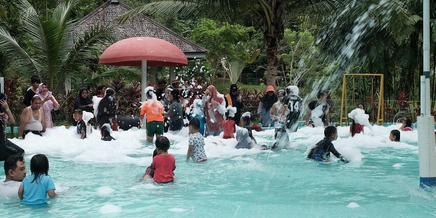 A view of a water ride and large pool for some family time at Hindustan Water Park.