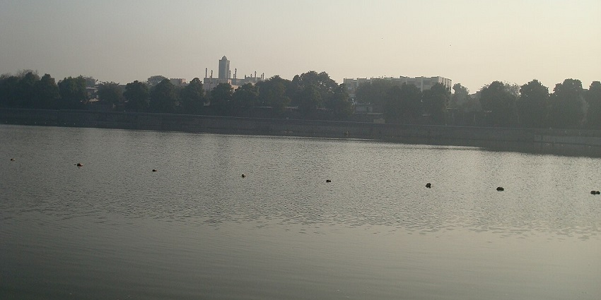 Tranquil Hipparga Lake surrounded by greenery, perfect for picnics and relaxation