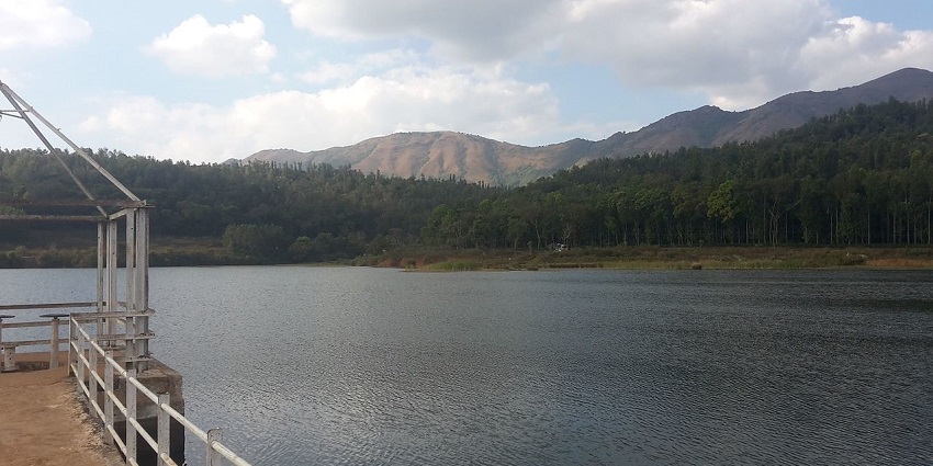 Hirekolale Lake features tranquil reservoir with lush hills and stunning sunsets
