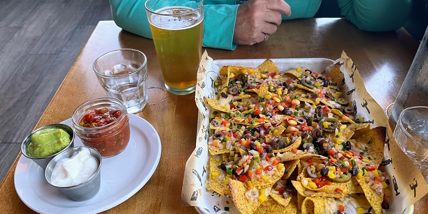 Nachos, a tortilla dish covered with vegetables, one of the best food in Bandra to try.