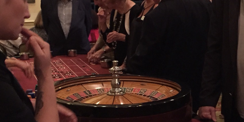 People having a thrilling night playing roulette.