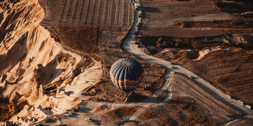 An image of a hot air balloon offers stunning views of Jaisalmer's desert charm.