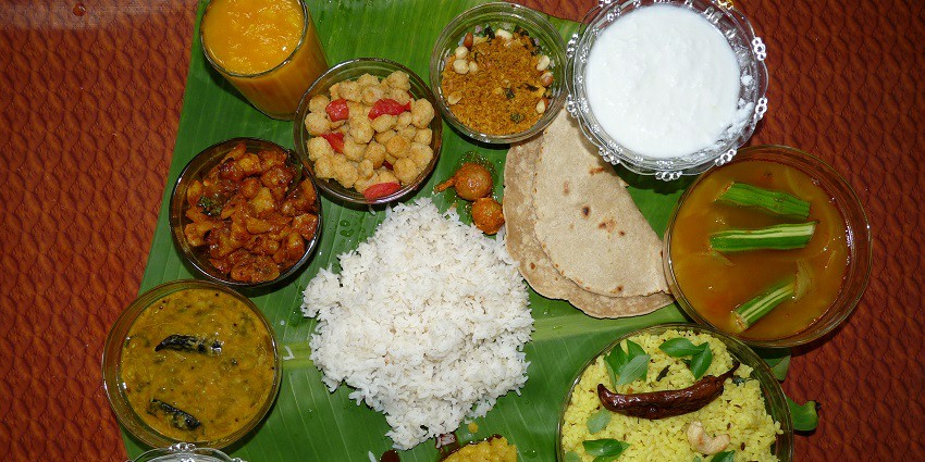 Authentic Andhra thali served on a banana leaf, offering a full local experience