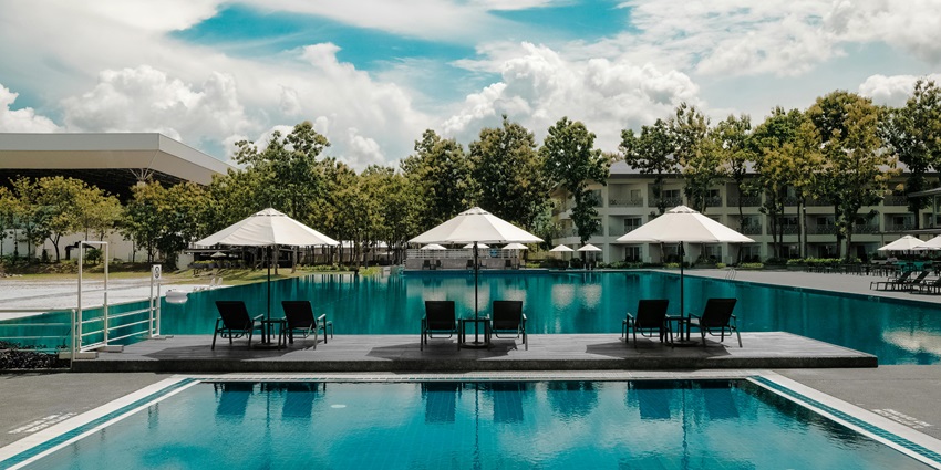 An inside view of Hotel Sanman featuring serene pools and family-friendly ambience.