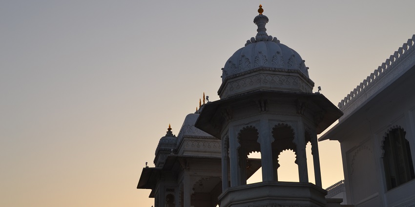 Pool party in Udaipur hotel blending traditional architecture with modern amenities and comfort.