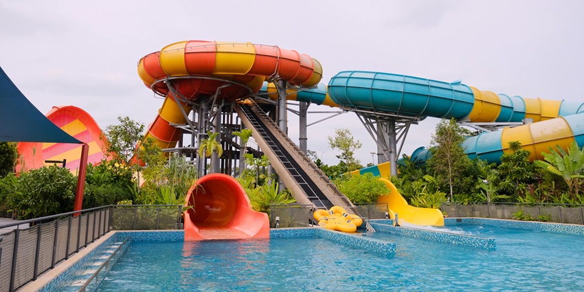 Feel the excitement of a thrilling water slide ride at a Fun Planet Water Park.